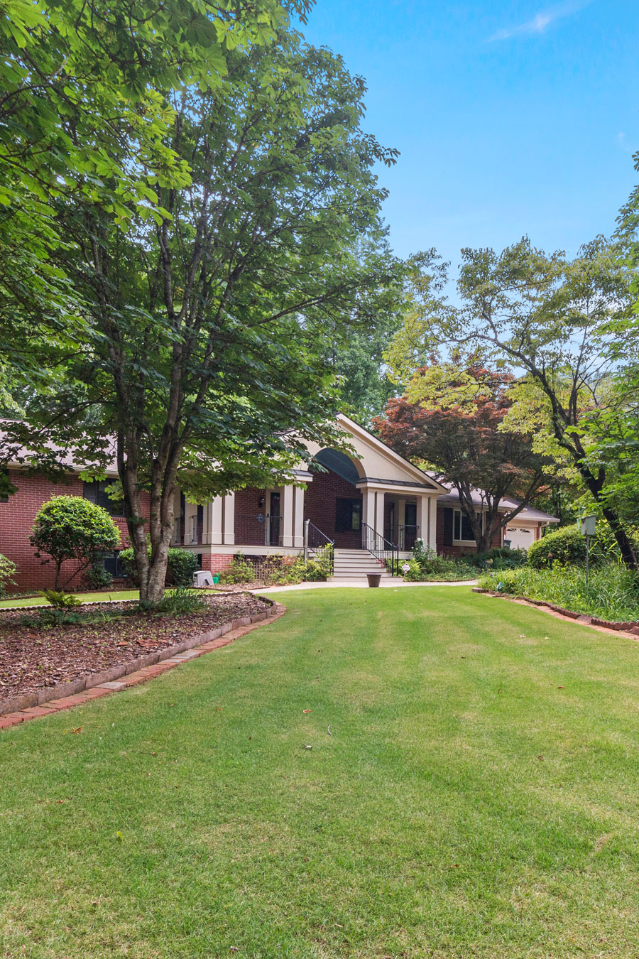 Aerial view of McEver Park in Acworth, GA, featuring the park sign, pool, and surrounding greenery.